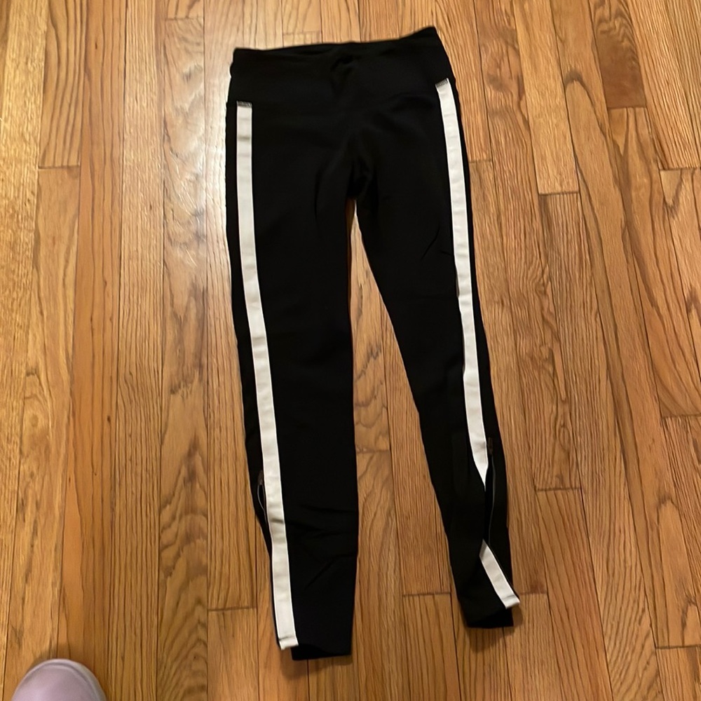 Athleta black with cream stripe leggings w zipper at bottom